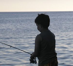 Tips for Fishing with Kids. little boy fishing