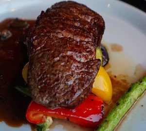 Check Out Historic Brunswick, GA. steak on a white plate