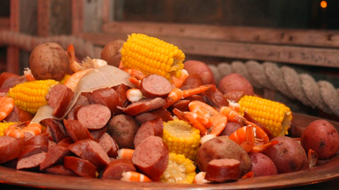 Discover Coastal Georgian Cuisine. Lowcountry Boil corn, sausage, potatoes and shrimp