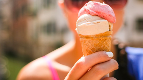 Ice Cream Shops on St. Simons.. Woman with strawberry and chocolate ice cream cone