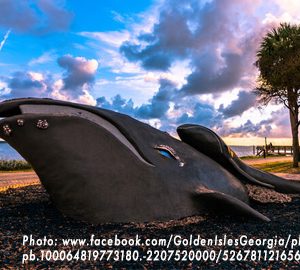 Mama Whale and Baby Sculpture on Saint Simons Island. A large outdoor sculpture of a whale