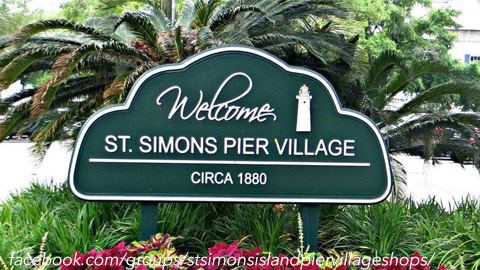 A Local's Guide to Pier Village on St. Simons Island. a green sign