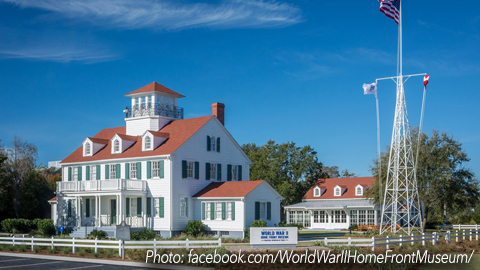 World War II Home Front Museum. a white colonial house with a red roof